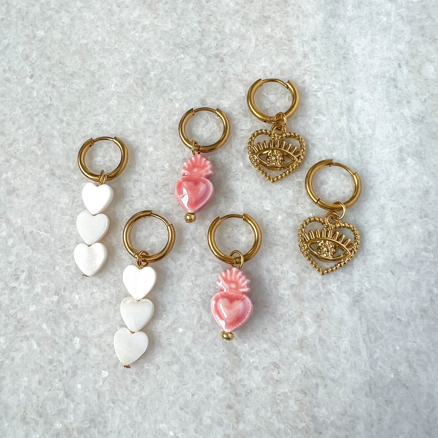 pearlescent hearts oorbellen - goud